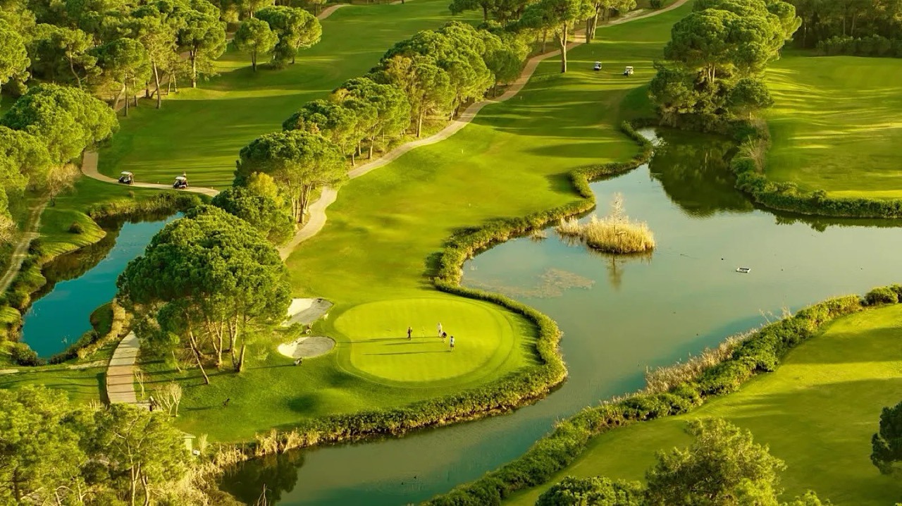 Golfer teeing off at Cullinan Links Golf Course in Belek
